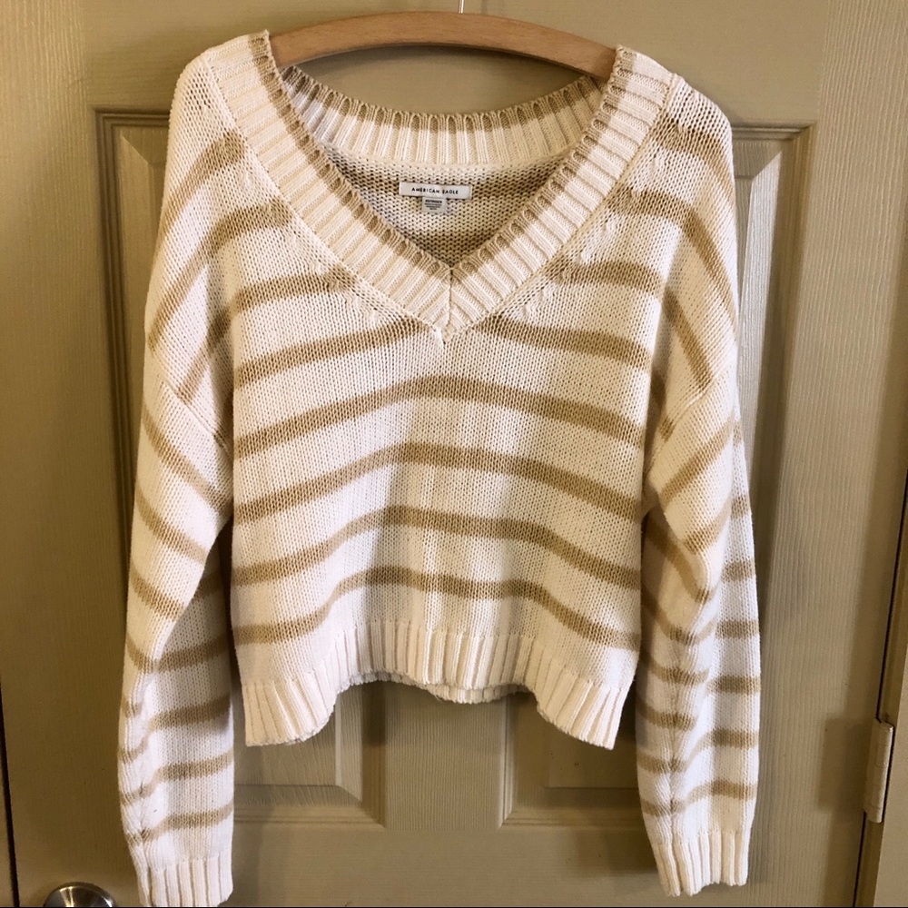 Beige and white striped oversized V-neck sweater